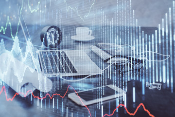 Stock market graph and table with computer background. Double exposure. Concept of financial analysis.
