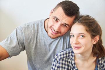 Happy young couple in the new apartment