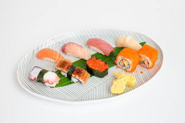 Japanese nigiri sushi set of traditional food on white plate