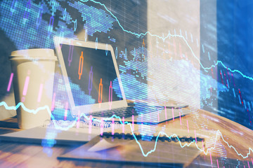 Forex market graph hologram and personal computer on background. Multi exposure. Concept of...