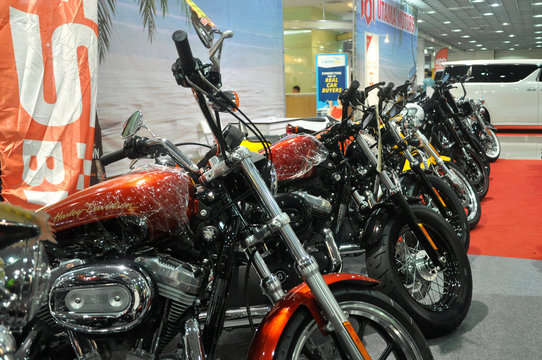 KUALA LUMPUR, MALAYSIA -JUNE 19, 2017: Big bike motorcycle display in huge showroom. Some of the motorcycle still in wrapping plastic to protect its body from scratch. 