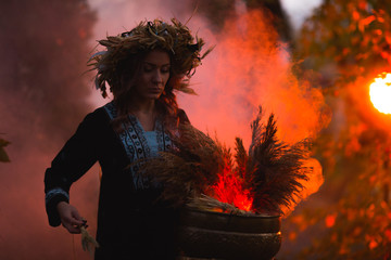 Woman sitting in burning pentagram circle, magic.