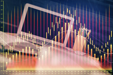 Financial chart drawing and table with computer on background. Multi exposure. Concept of international markets.