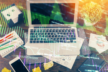 Multi exposure of chart and financial info and work space with computer background. Concept of...