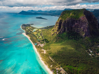 Tropical island with Le Morne mountain, blue ocean and beach in Mauritius. Aerial view