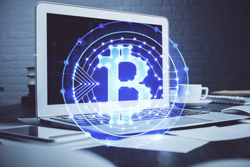 Multi exposure of blockchain theme hologram and table with computer background. Concept of bitcoin...
