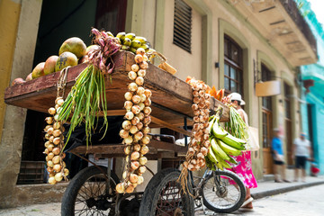 Trolley on wheels with vegetables and fruits for outdoor trading
