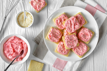 shortbread cookies with pink frosting, top view