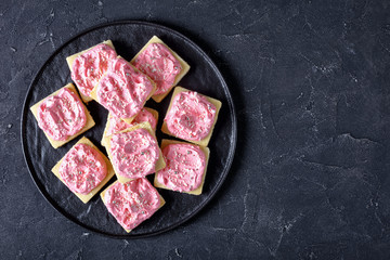 shortbread cookies with pink frosting, top view