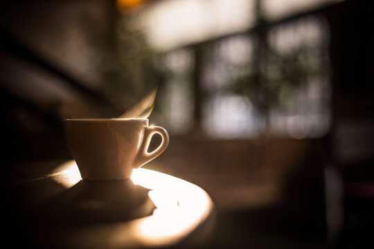 Steamy coffee cup in the sunlight
