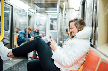 Fototapeta na wymiar Woman travel in subway with smartphone