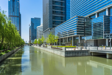 modern buildings at riverbank in shanghai. - obrazy, fototapety, plakaty
