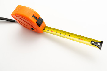 orange plastic construction tape measure on white background
