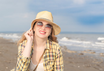 beautiful happy woman at the seaside dancing and singing funny songs