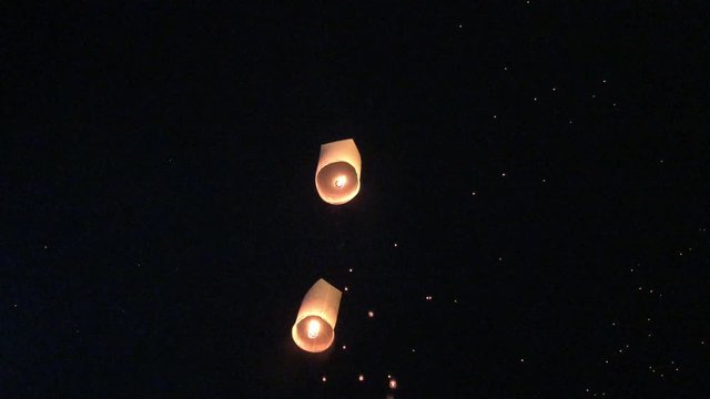 Release floating lanterns in the night sky. Launching Sky Lantern  rise festival of lights. Yee Peng Festival, Loy Krathong celebration in ChiangMai,Thailand