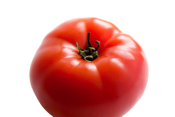 A ripe fresh red tomato isolated on white background, side view