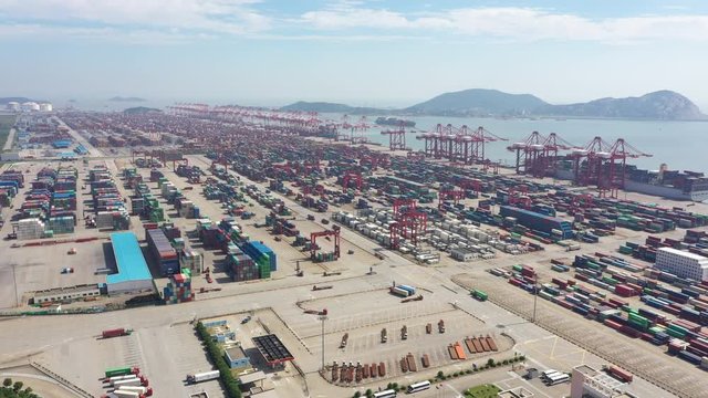 Panoramic drone flight of huge container terminals in the Port of Shanghai, commerce and trade in China