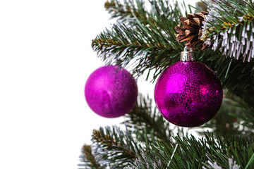 New Year background. Isolated Christmas ball on branch of spruce tree