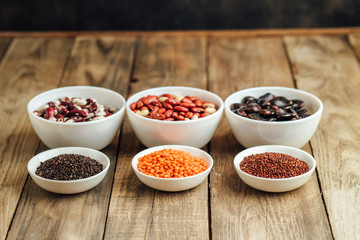 Super food. Seeds and beans assortment on a rustic background copy space. Vegetarians..