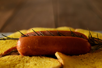 cooked frankfurter served with tiny pumpkin bread slices