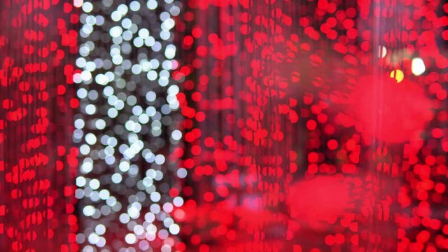 Red Festive bokeh light Christmas background. Abstract elegant defocused glitter ruby color texture concept for sparkle glamour xmas festival holiday, valentine shimmer gala party event.
