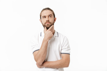 Handsome bearded man posing isolated over white wall background.