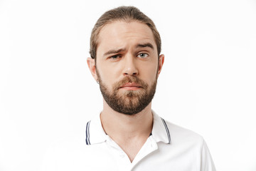Obraz premium Bearded man posing isolated over white wall background.