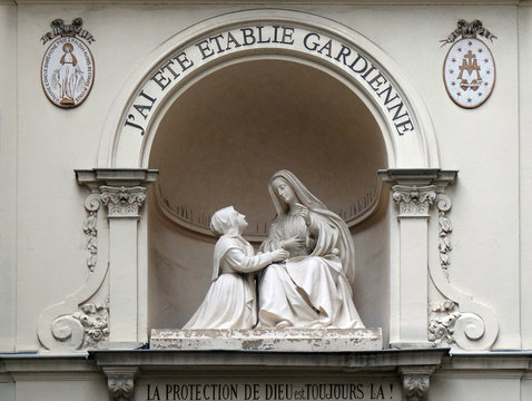 Statue of St Catherine and the Virgin Mary outside the Chapelle Notre Dame de la Medaille Miraculeuse in Paris, France