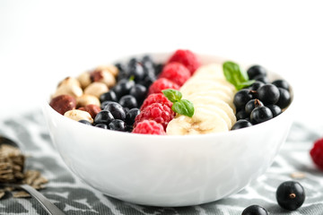 .Oatmeal with berries and fruits on a light background. Healthy breakfast.