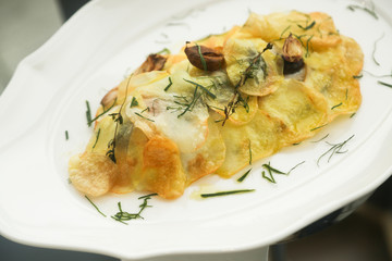 Fish baked with olives and potato