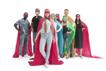 leader and a group of young men in a variety of superhero cloaks © ASDF