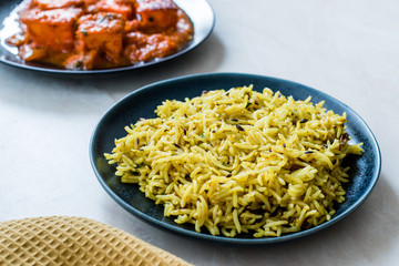 Indian Food Jeera Zira Rice Basmati Pilaf or Pilav with Paneer Butter Tikka Masala / Cheese Cottage Curry.