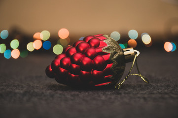 Christmas toy cone on garland background