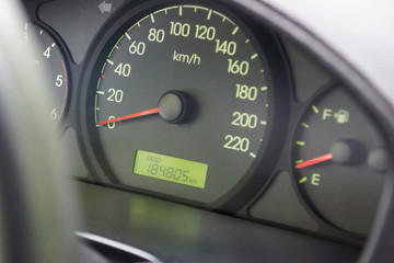 speedometer, fuel gauge, odometer with the actual mileage on the dashboard - obrazy, fototapety, plakaty