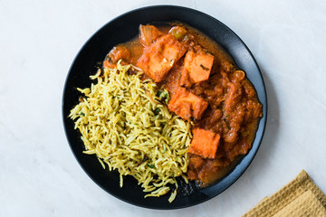 Indian Food Paneer Butter Tikka Masala / Cheese Cottage Curry and Jeera Zira Rice Basmati Pilaf or Pilav.