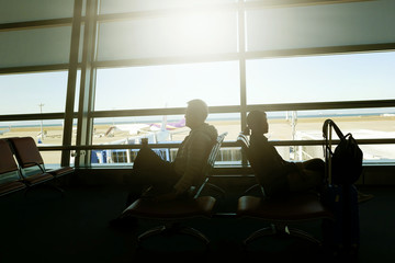 Men and women waiting for the plane