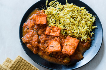 Indian Food Paneer Butter Tikka Masala / Cheese Cottage Curry and Jeera Zira Rice Basmati Pilaf or Pilav.