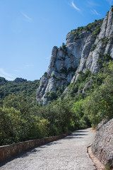Fototapeta na wymiar Monserat stone mountains in sunny weather, mountain trail