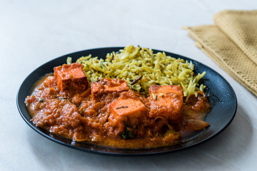 Indian Food Paneer Butter Tikka Masala / Cheese Cottage Curry and Jeera Zira Rice Basmati Pilaf or Pilav.