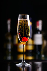 sparkling wine cocktail with cherry
