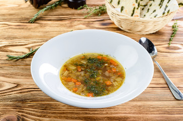 Vegetable soup on white plate