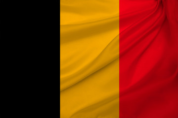 photograph of the beautiful colored national flag of the modern state of Belgium on textured fabric, concept of tourism, economics and politics, close-up