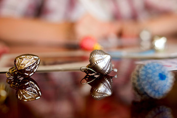 Beautiful christmas tree toys on the table: silver jingle bells