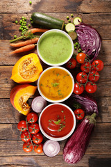 assortment of vegetable soup with ingredient, top view- wood background