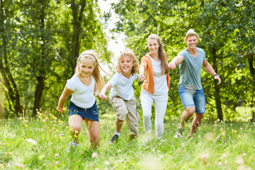 Happy family in the garden in summer