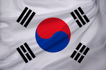 photo of the beautiful colored national flag of the modern state of South Korea on textured fabric, concept of tourism, emigration, economic