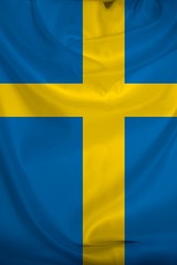 photo of the beautiful colored national flag of the modern state of Sweden on a textured fabric, concept of tourism, emigration, economics and politics, closeup