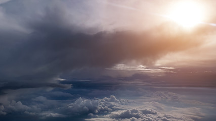 Stunning of aerial view among clouds from airplane window with blue sky. View from the airplane window to the blue sky and white clouds.
