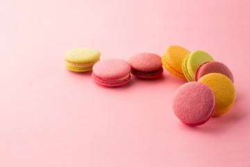 Sweet macarons on pink background
