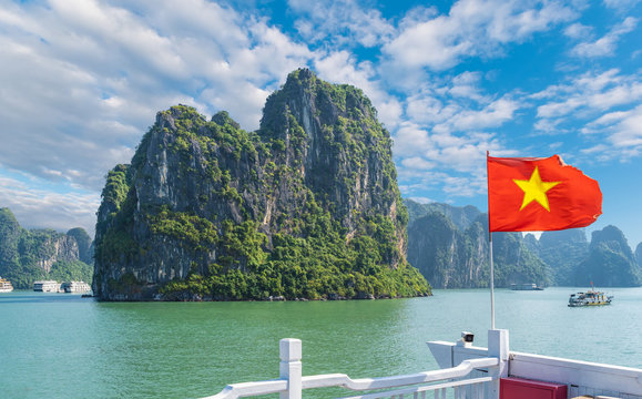 Landscape with Halong bay and Vietnamese flag, Vietnam